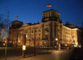 Run a lap at night around the Berlin Reichstag